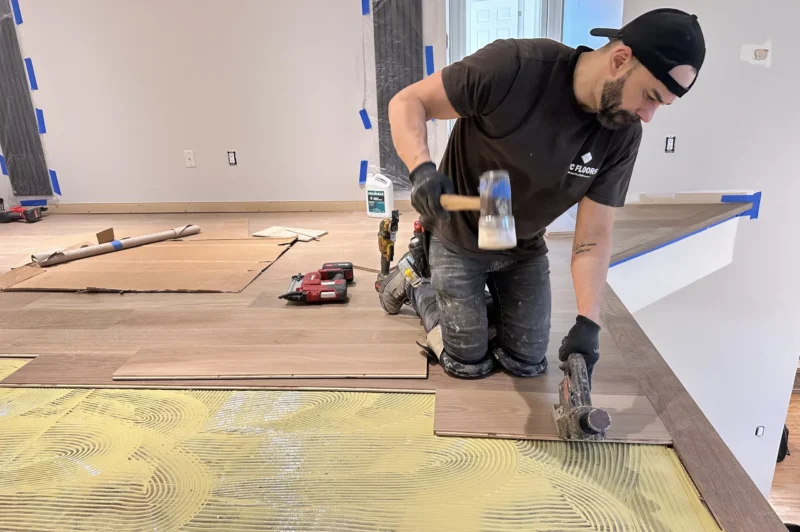 WC Floors Team Installing Glue-Down Engineered Flooring in New Jersey New Jersey hardwood floor installation using premium materials