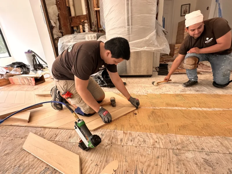 Chevron Hardwood Floor Installation by WC Floors in Morristown, New Jersey Hardwood floor installation pattern being aligned in New Jersey